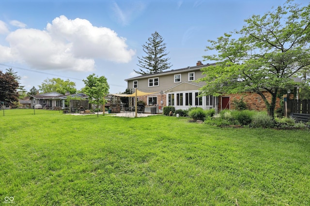 6825 Farmleigh Dr, Indianapolis, IN 46220 - rear view of property featuring a chimney, a patio, and stone siding