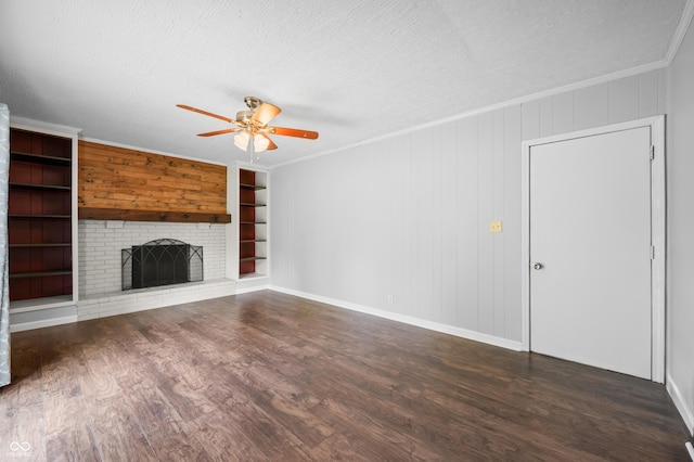 unfurnished living room with a ceiling fan, a textured ceiling, a brick fireplace, wood finished floors, and ornamental molding