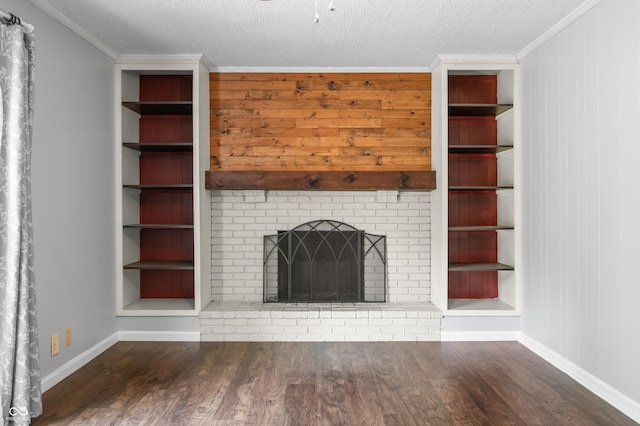 unfurnished living room with wood finished floors, baseboards, a fireplace, and ornamental molding