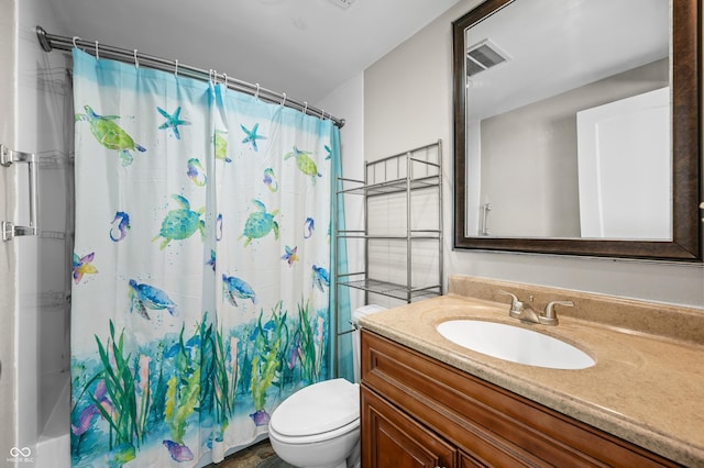full bath with toilet and vanity