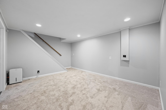 finished basement with recessed lighting, carpet floors, baseboards, ornamental molding, and stairs