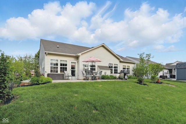 1663 Sweetgum Dr, Greenwood, IN 46143 - rear view of house featuring a patio area and a lawn