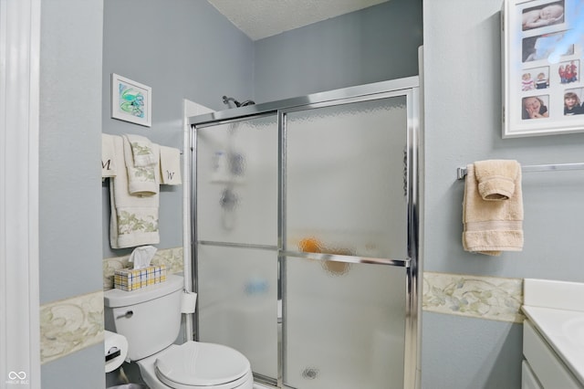 1663 Sweetgum Dr, Greenwood, IN 46143 - full bath with a stall shower, toilet, vanity, and a textured ceiling