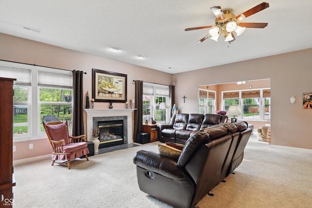 1663 Sweetgum Dr, Greenwood, IN 46143 - living area with carpet flooring, healthy amount of natural light, a premium fireplace, and ceiling fan