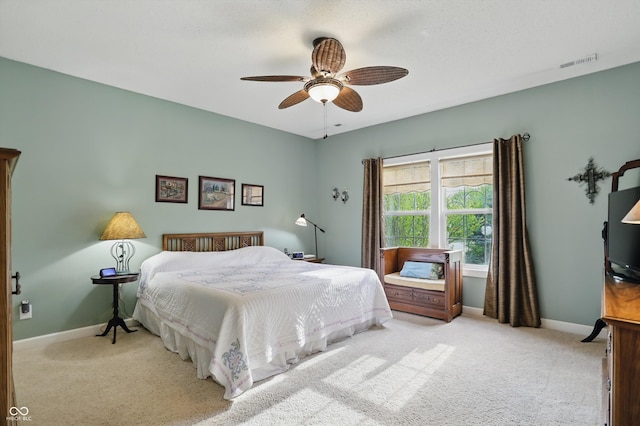 1663 Sweetgum Dr, Greenwood, IN 46143 - bedroom featuring light carpet, baseboards, and a ceiling fan