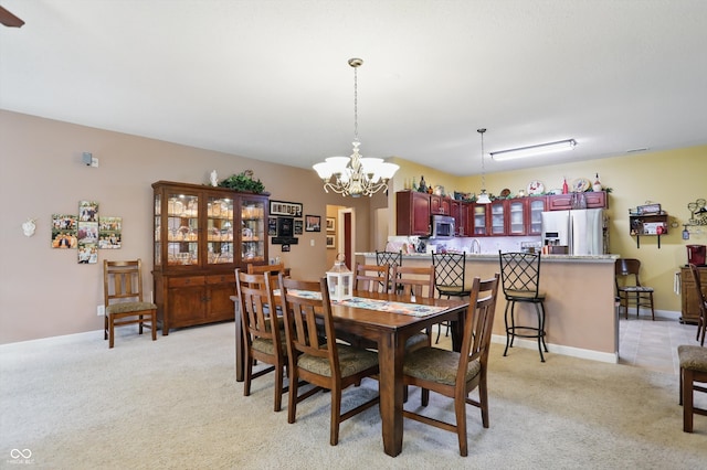 1663 Sweetgum Dr, Greenwood, IN 46143 - dining space with a chandelier and light carpet