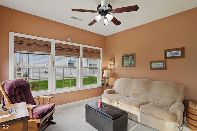 1663 Sweetgum Dr, Greenwood, IN 46143 - carpeted living area with a ceiling fan, healthy amount of natural light, and baseboards