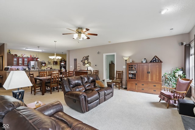 1663 Sweetgum Dr, Greenwood, IN 46143 - living room with light colored carpet, a ceiling fan, and a chandelier