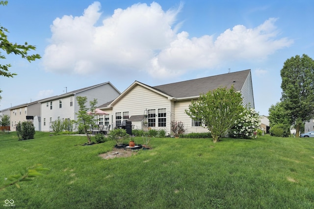 1663 Sweetgum Dr, Greenwood, IN 46143 - rear view of house featuring a yard