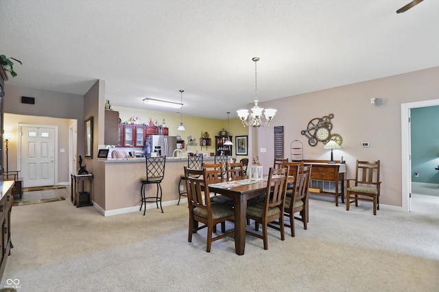 1663 Sweetgum Dr, Greenwood, IN 46143 - dining room featuring light colored carpet, a chandelier, and baseboards
