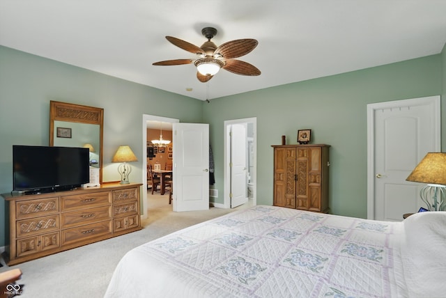 1663 Sweetgum Dr, Greenwood, IN 46143 - bedroom featuring carpet flooring, ensuite bathroom, ceiling fan, and a chandelier