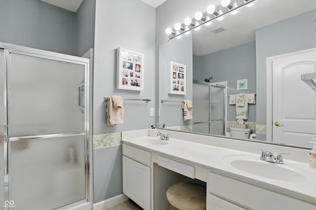 1663 Sweetgum Dr, Greenwood, IN 46143 - bathroom featuring a stall shower and double vanity