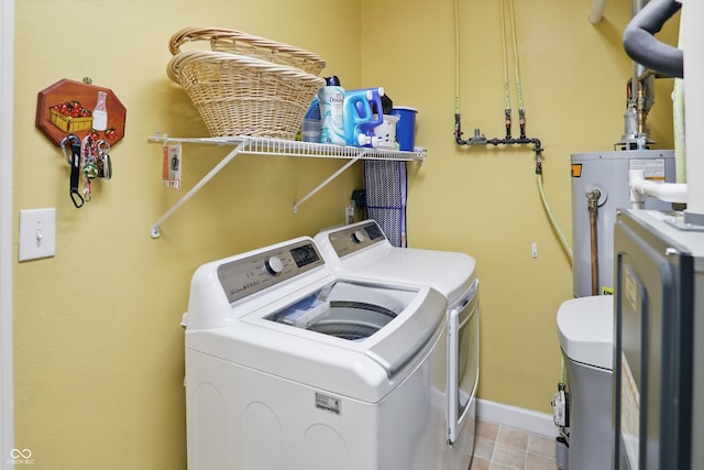 1663 Sweetgum Dr, Greenwood, IN 46143 - clothes washing area with separate washer and dryer, water heater, light tile patterned floors, and baseboards