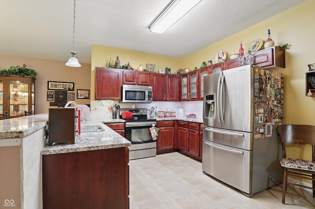 1663 Sweetgum Dr, Greenwood, IN 46143 - kitchen with appliances with stainless steel finishes, dark brown cabinets, a peninsula, a sink, and glass insert cabinets
