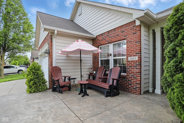 1663 Sweetgum Dr, Greenwood, IN 46143 - view of patio / terrace featuring a garage