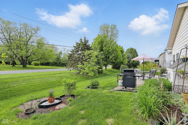 1663 Sweetgum Dr, Greenwood, IN 46143 - view of grassy yard with a patio
