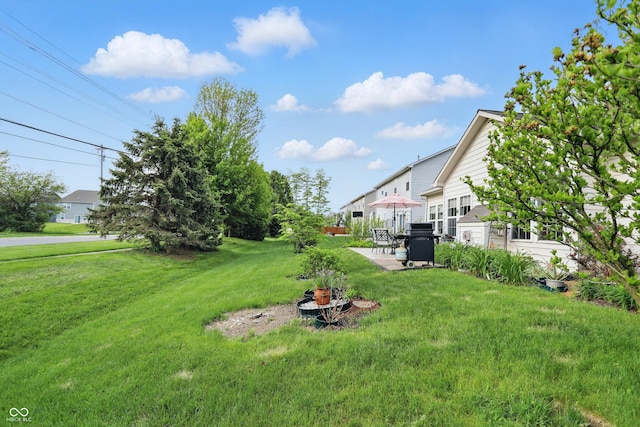 1663 Sweetgum Dr, Greenwood, IN 46143 - view of grassy yard with a patio area