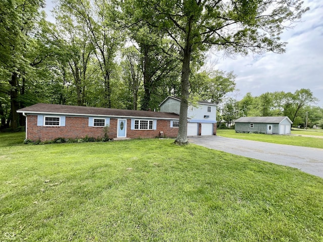 206 Windemere Rd, West Terre Haute, IN 47885 - view of front of property featuring driveway, brick siding, a garage, and a front yard