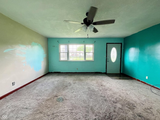 206 Windemere Rd, West Terre Haute, IN 47885 - empty room with ceiling fan, carpet floors, baseboards, and a textured ceiling