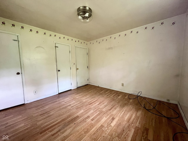 206 Windemere Rd, West Terre Haute, IN 47885 - unfurnished bedroom with wood finished floors and baseboards