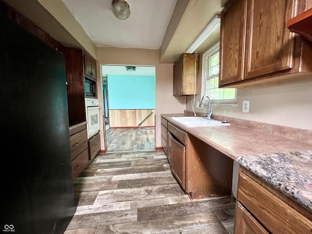 206 Windemere Rd, West Terre Haute, IN 47885 - kitchen with a sink, white oven, wood finished floors, and built in microwave