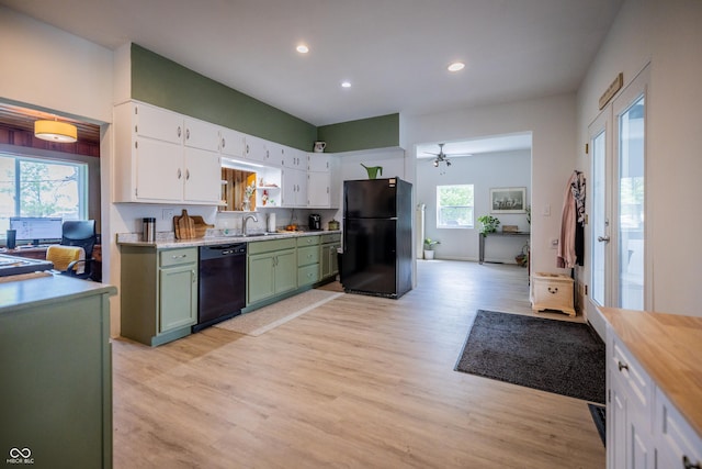 kitchen featuring black appliances, a ceiling fan, white cabinetry, light wood-type flooring, and recessed lighting
