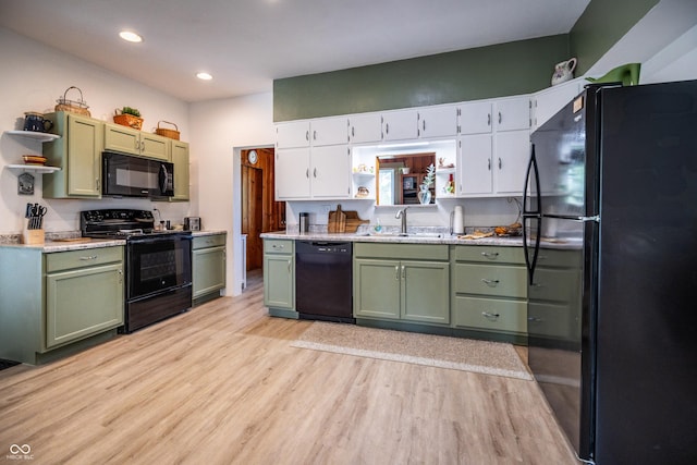 kitchen featuring green cabinetry, black appliances, open shelves, and recessed lighting