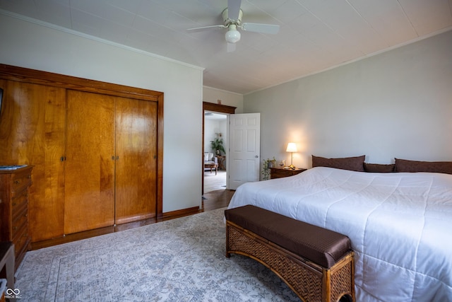 bedroom with crown molding, wood finished floors, and a ceiling fan