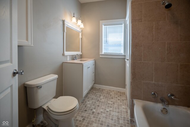 bathroom featuring vanity, toilet, shower / bathtub combination, and tile patterned floors