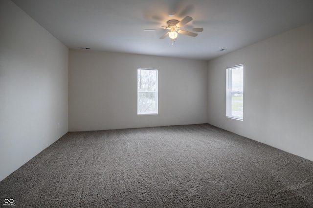 carpeted empty room with ceiling fan