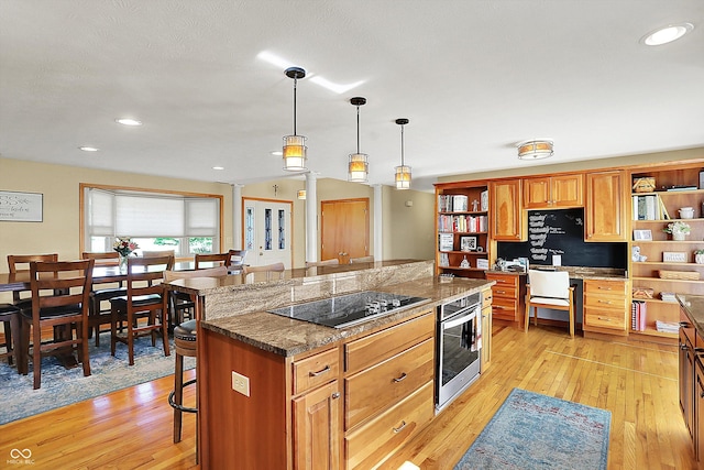 2769 S 800 W, Indianapolis, IN 46239 - kitchen with black electric stovetop, open shelves, a kitchen breakfast bar, light wood-style floors, and recessed lighting