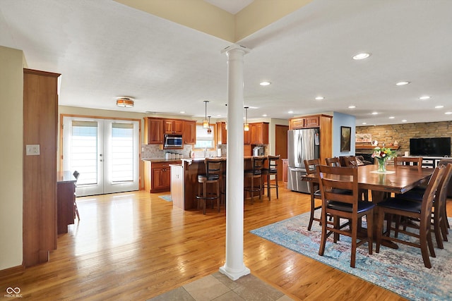 2769 S 800 W, Indianapolis, IN 46239 - dining space with decorative columns, light wood-style floors, and recessed lighting
