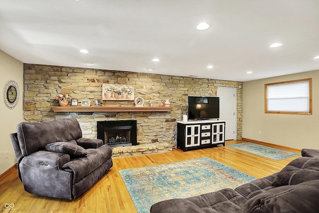 2769 S 800 W, Indianapolis, IN 46239 - living area featuring baseboards, wood finished floors, and a stone fireplace