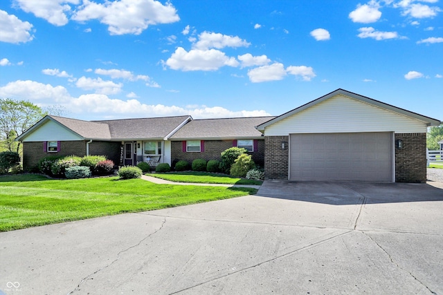 2769 S 800 W, Indianapolis, IN 46239 - ranch-style house featuring brick siding, a front yard, concrete driveway, and a garage