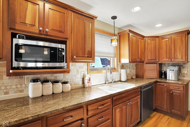 2769 S 800 W, Indianapolis, IN 46239 - kitchen featuring appliances with stainless steel finishes, a sink, brown cabinets, and recessed lighting