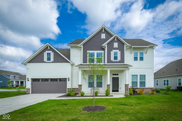 15792 Wiseman Dr, Fishers, IN 46040 - craftsman inspired home featuring stone siding, driveway, a front lawn, cooling unit, and a garage