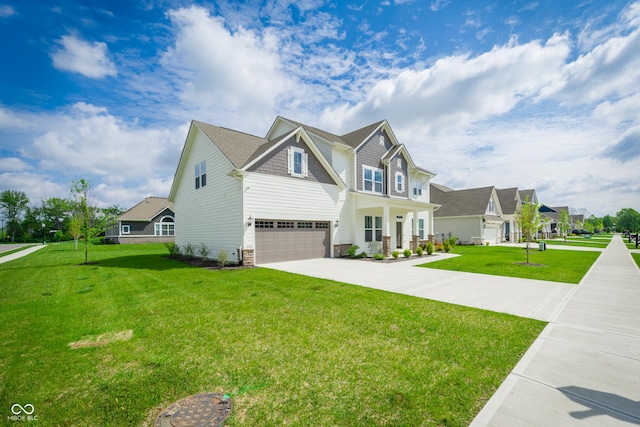 15792 Wiseman Dr, Fishers, IN 46040 - craftsman-style house with a garage, stone siding, driveway, and a front lawn