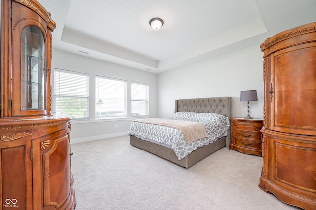 15792 Wiseman Dr, Fishers, IN 46040 - bedroom featuring a tray ceiling, light carpet, and baseboards