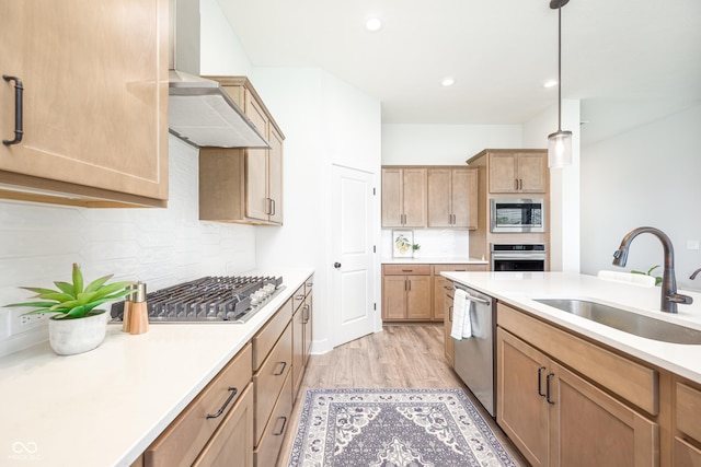 15792 Wiseman Dr, Fishers, IN 46040 - kitchen featuring a sink, appliances with stainless steel finishes, decorative backsplash, light countertops, and pendant lighting