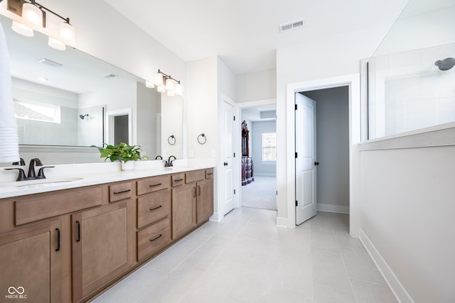 15792 Wiseman Dr, Fishers, IN 46040 - bathroom with walk in shower, double vanity, baseboards, and tile patterned floors
