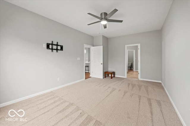 unfurnished bedroom with carpet floors, baseboards, and a ceiling fan