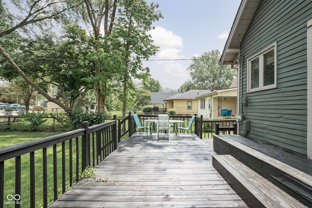 6159 Broadway St, Indianapolis, IN 46220 - wooden deck with outdoor dining area and a lawn