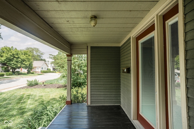 6159 Broadway St, Indianapolis, IN 46220 - wooden deck featuring a porch and a lawn