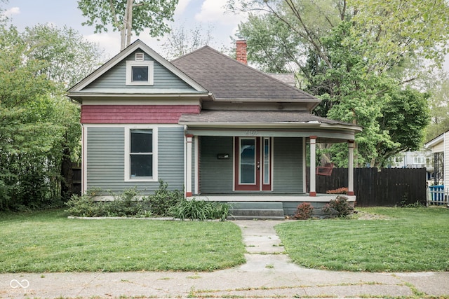 6159 Broadway St, Indianapolis, IN 46220 - bungalow-style house featuring a porch, a chimney, and a shingled roof