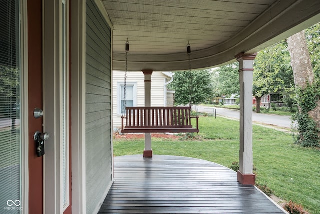 6159 Broadway St, Indianapolis, IN 46220 - deck featuring covered porch and a lawn