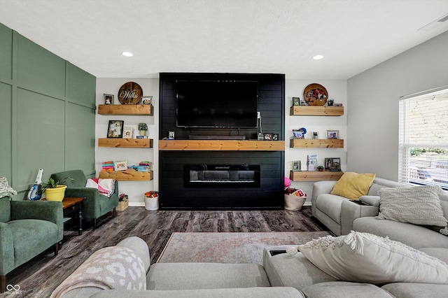 4032 Stubbington Ln, Indianapolis, IN 46239 - living area with dark wood finished floors, a large fireplace, and recessed lighting