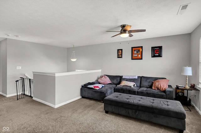 4032 Stubbington Ln, Indianapolis, IN 46239 - living area featuring carpet, baseboards, a ceiling fan, and a textured ceiling