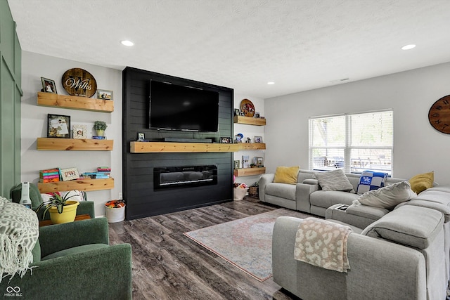 4032 Stubbington Ln, Indianapolis, IN 46239 - living area featuring wood finished floors, a large fireplace, recessed lighting, and a textured ceiling