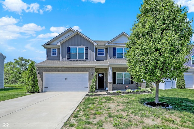 4032 Stubbington Ln, Indianapolis, IN 46239 - view of front facade featuring a front yard, driveway, an attached garage, and brick siding