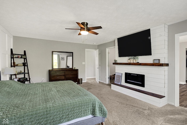 4032 Stubbington Ln, Indianapolis, IN 46239 - bedroom with a fireplace, carpet flooring, baseboards, and a ceiling fan